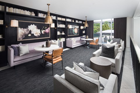 a living room with couches and chairs and tables